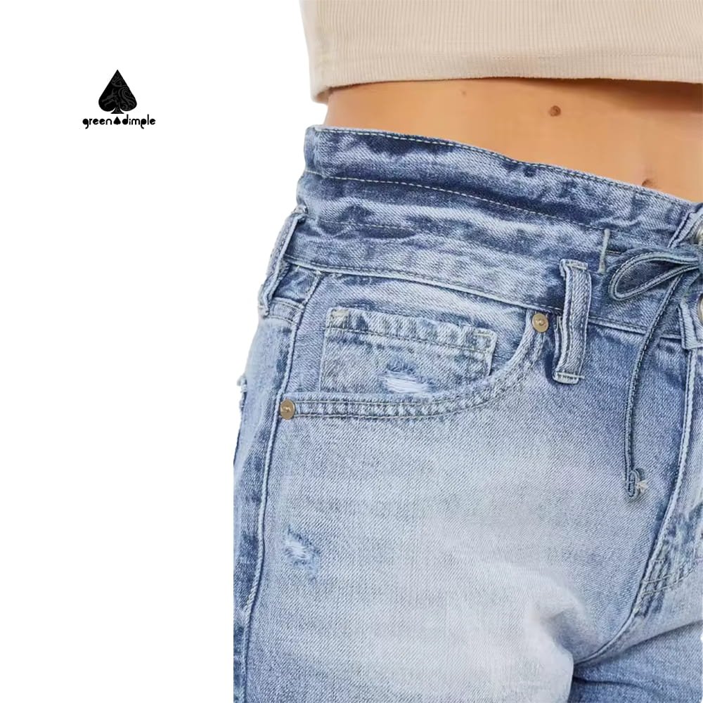 Detail of frayed hem and denim fabric women shorts