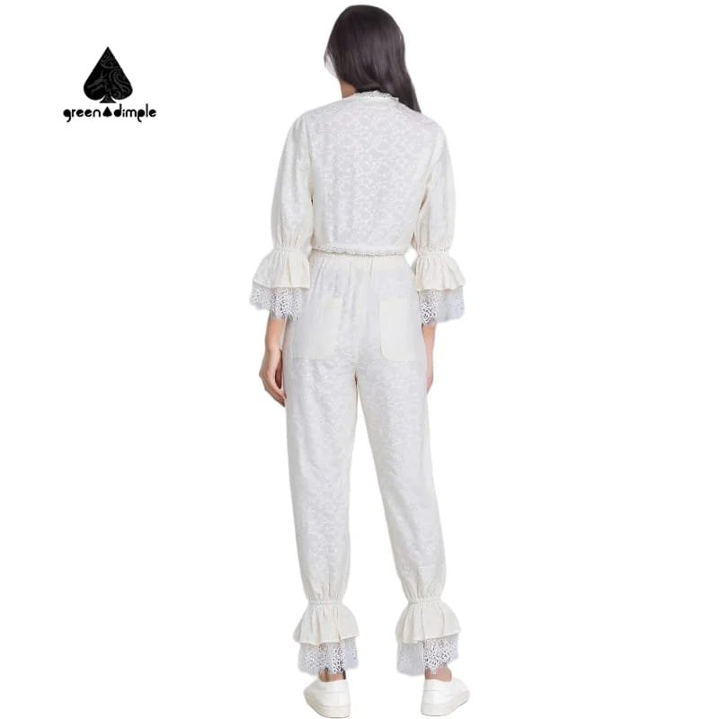 Back view of white lace two piece set for women showing elastic waist pants and lace details