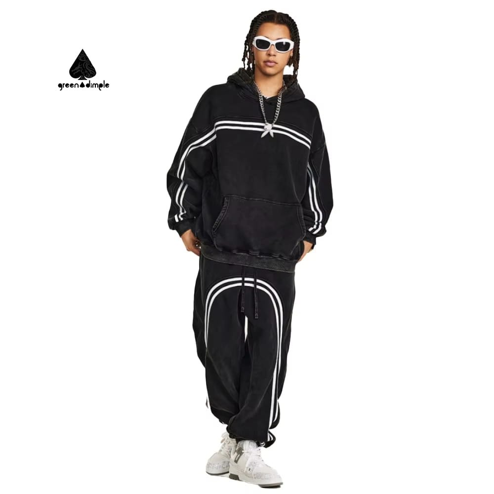 black hoodie and sweatpants set, front view with distressed patch details and contrast stripes