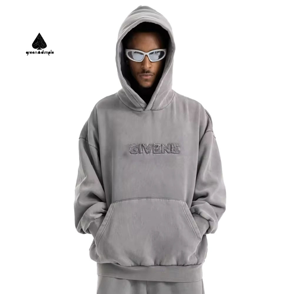 oversized french terry hoodie front view with 3d embossed logo